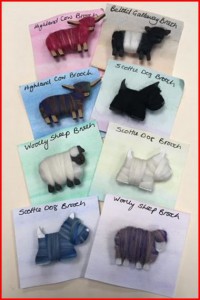 Handmade brooches with different animals on them